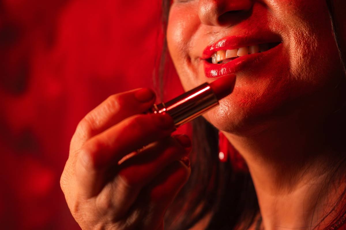 Vibrant festive lip colors applied using layered technique on diverse skin tones